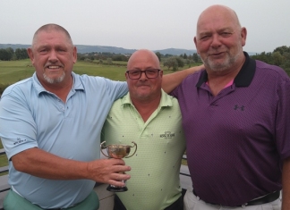 Brean Golf Club's Seniors Open Pairs winners Leighton Jenkins (left) and Chris Fairchild (right) flanking Seniors Captain Ian Rogers