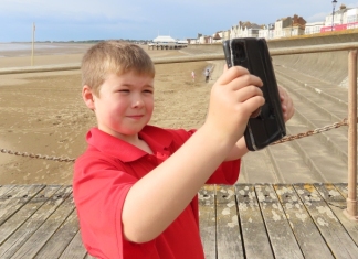 Dom Jefferies in Burnham-On-Sea recording a beach safety video