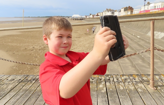 Dom Jefferies in Burnham-On-Sea recording a beach safety video