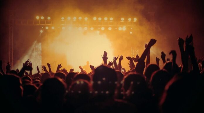 band performing on stage in front of people